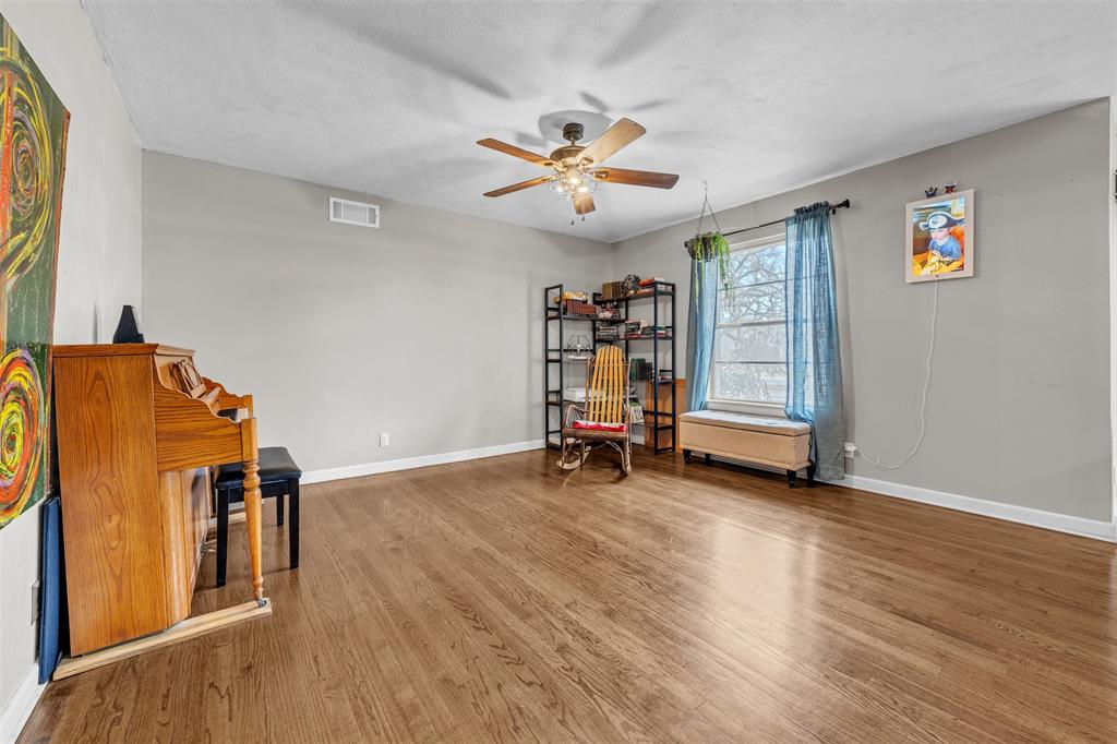 106 Lakeridge Road Lakeside, TX 76108 - Photo 11 of 40 a view of a room with wooden floor and ceiling fan