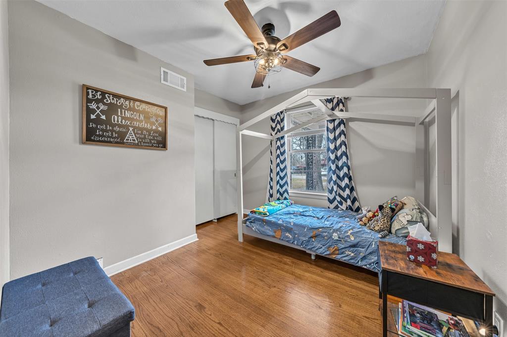 106 Lakeridge Road Lakeside, TX 76108 - Photo 18 of 40 a view of a livingroom with wooden floor and a ceiling fan