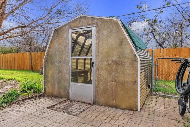 a view of a car park in front of house
