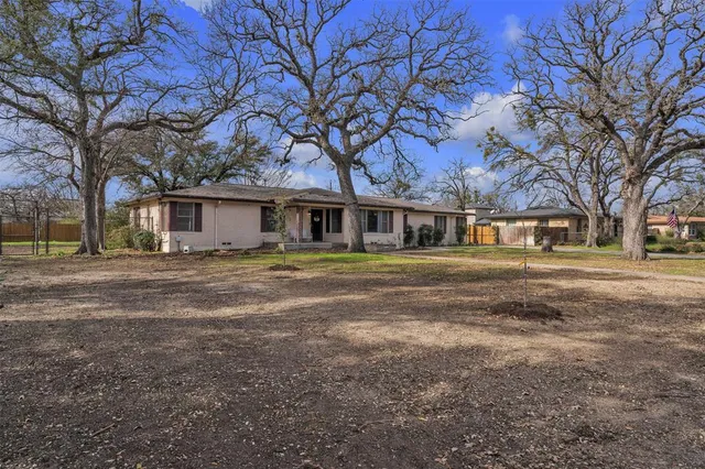front view of a house with a iron fence