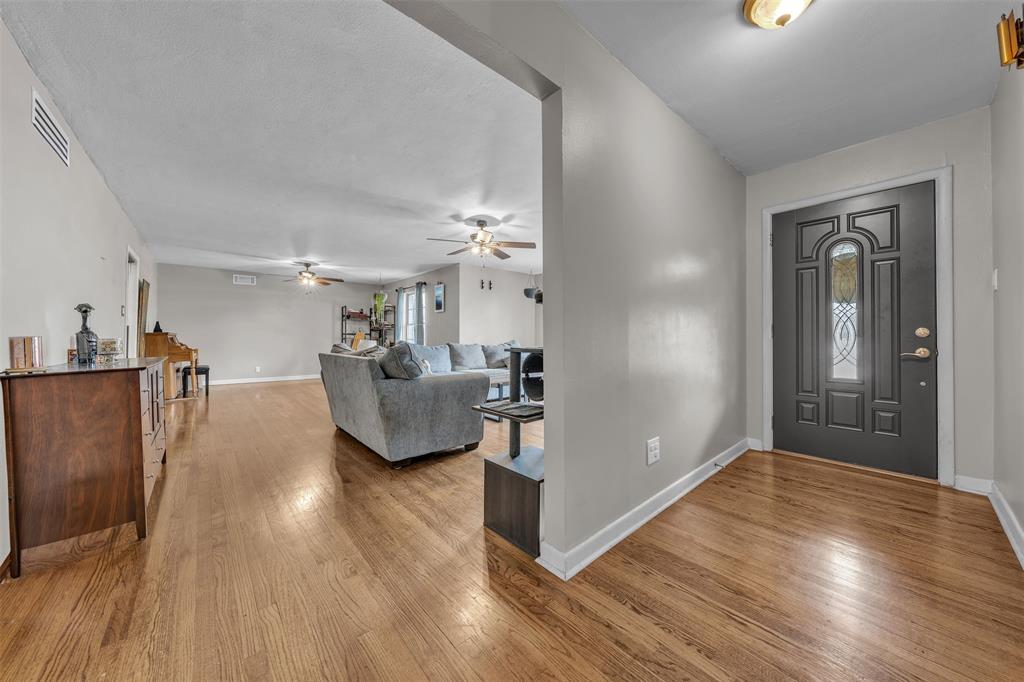 106 Lakeridge Road Lakeside, TX 76108 - Photo 7 of 40 a living room with furniture and a chandelier
