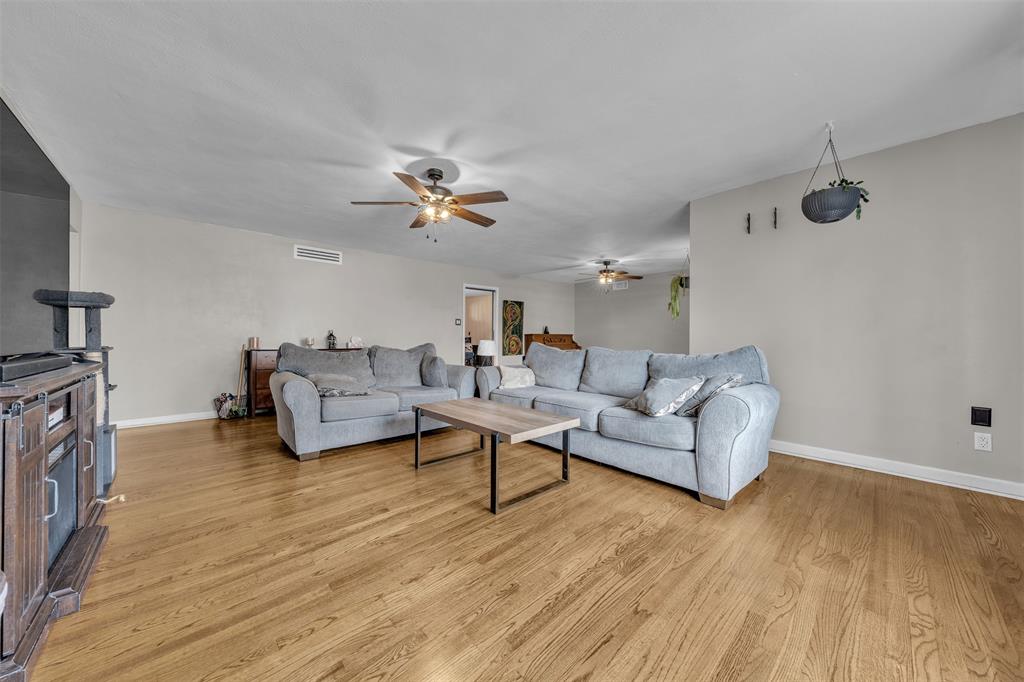 106 Lakeridge Road Lakeside, TX 76108 - Photo 8 of 40 a living room with furniture and a wooden floor