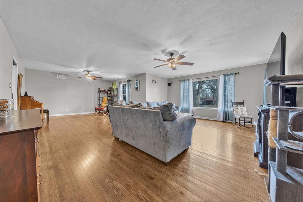 106 Lakeridge Road Lakeside, TX 76108 - Photo 9 of 40 a living room with furniture and a wooden floor