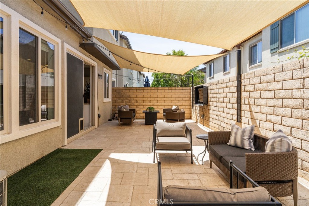6807 Simmons Way Moorpark, CA 93021 - Photo 26 of 43 a view of a patio with couches table and chairs and potted plants