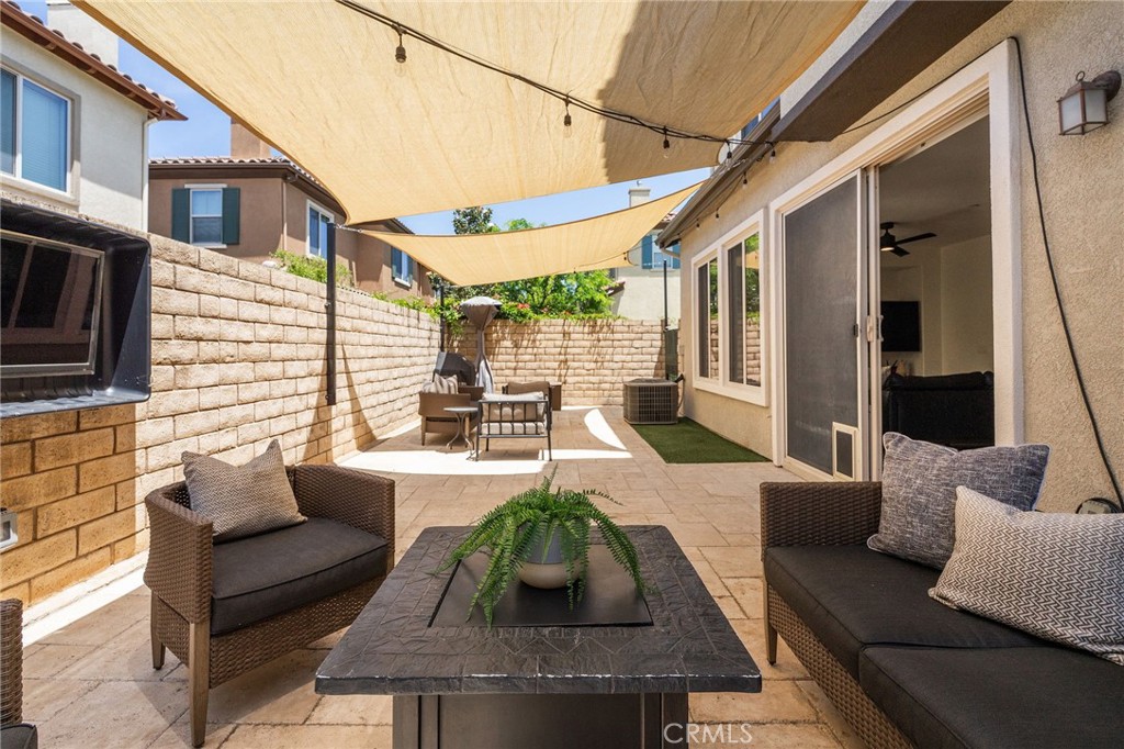 6807 Simmons Way Moorpark, CA 93021 - Photo 29 of 43 a view of a patio with couches chairs and a potted plant