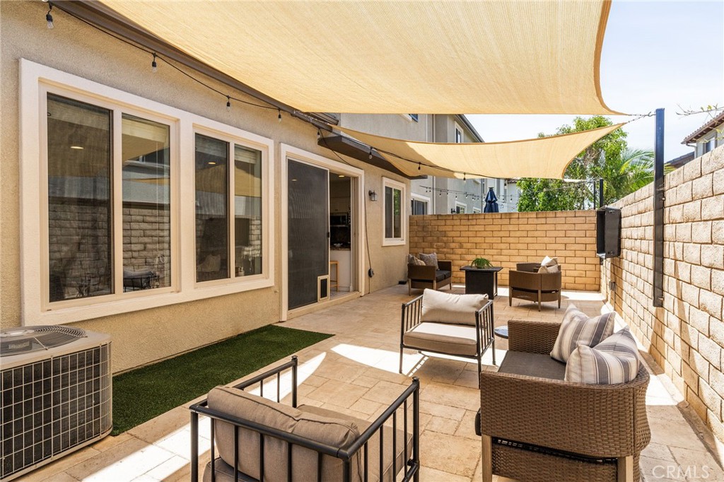 6807 Simmons Way Moorpark, CA 93021 - Photo 30 of 43 a outdoor space with patio the couches and a dining table with chairs