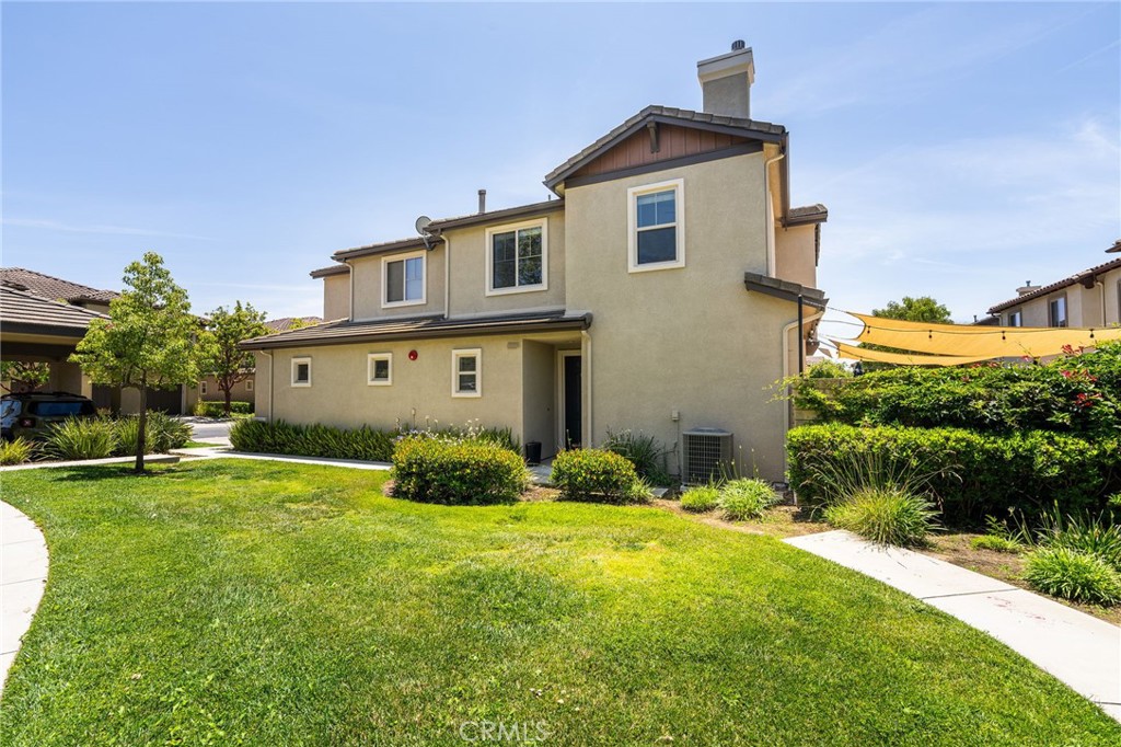 6807 Simmons Way Moorpark, CA 93021 - Photo 31 of 43 a front view of a house with a yard