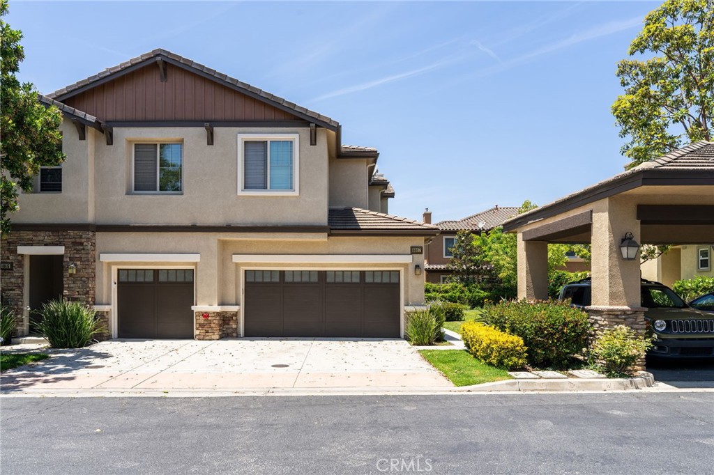 6807 Simmons Way Moorpark, CA 93021 - Photo 43 of 43 a front view of a house with a yard and a garage