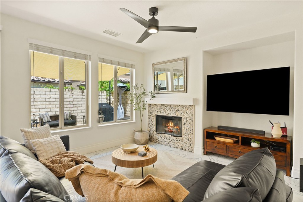 6807 Simmons Way Moorpark, CA 93021 - Photo 8 of 43 a living room with furniture and a flat screen tv