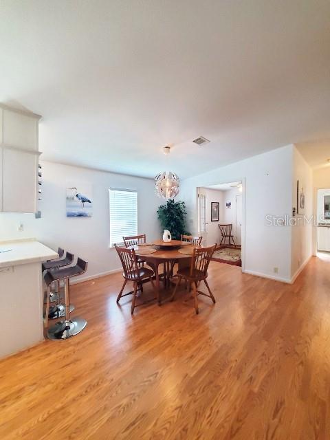 29200 South Jones Loop Road, Unit 125 Punta Gorda, FL 33950 - Photo 15 of 52 a living room with furniture and a dining table