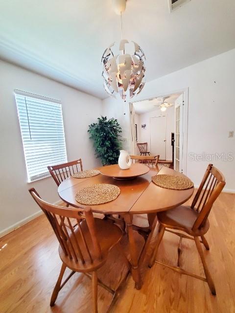 29200 South Jones Loop Road, Unit 125 Punta Gorda, FL 33950 - Photo 16 of 52 a dining room with a table and chairs