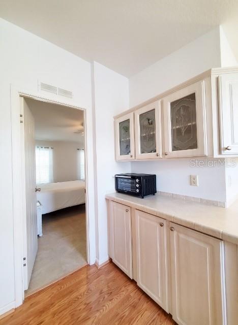 29200 South Jones Loop Road, Unit 125 Punta Gorda, FL 33950 - Photo 19 of 52 a kitchen with a sink and cabinets
