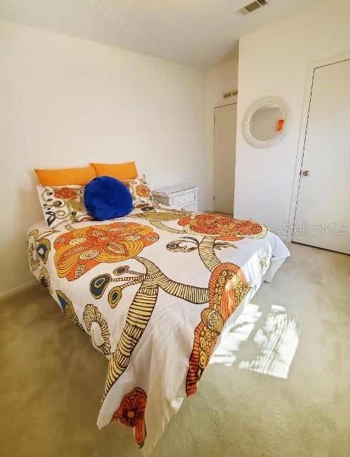 29200 South Jones Loop Road, Unit 125 Punta Gorda, FL 33950 - Photo 33 of 52 a bedroom with a bed and a window