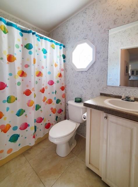 29200 South Jones Loop Road, Unit 125 Punta Gorda, FL 33950 - Photo 35 of 52 a bathroom with a sink toilet and shower