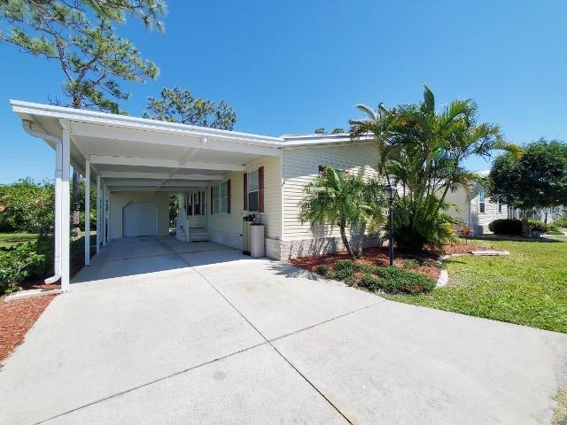29200 South Jones Loop Road, Unit 125 Punta Gorda, FL 33950 - Photo 4 of 52 a view of a house with a patio