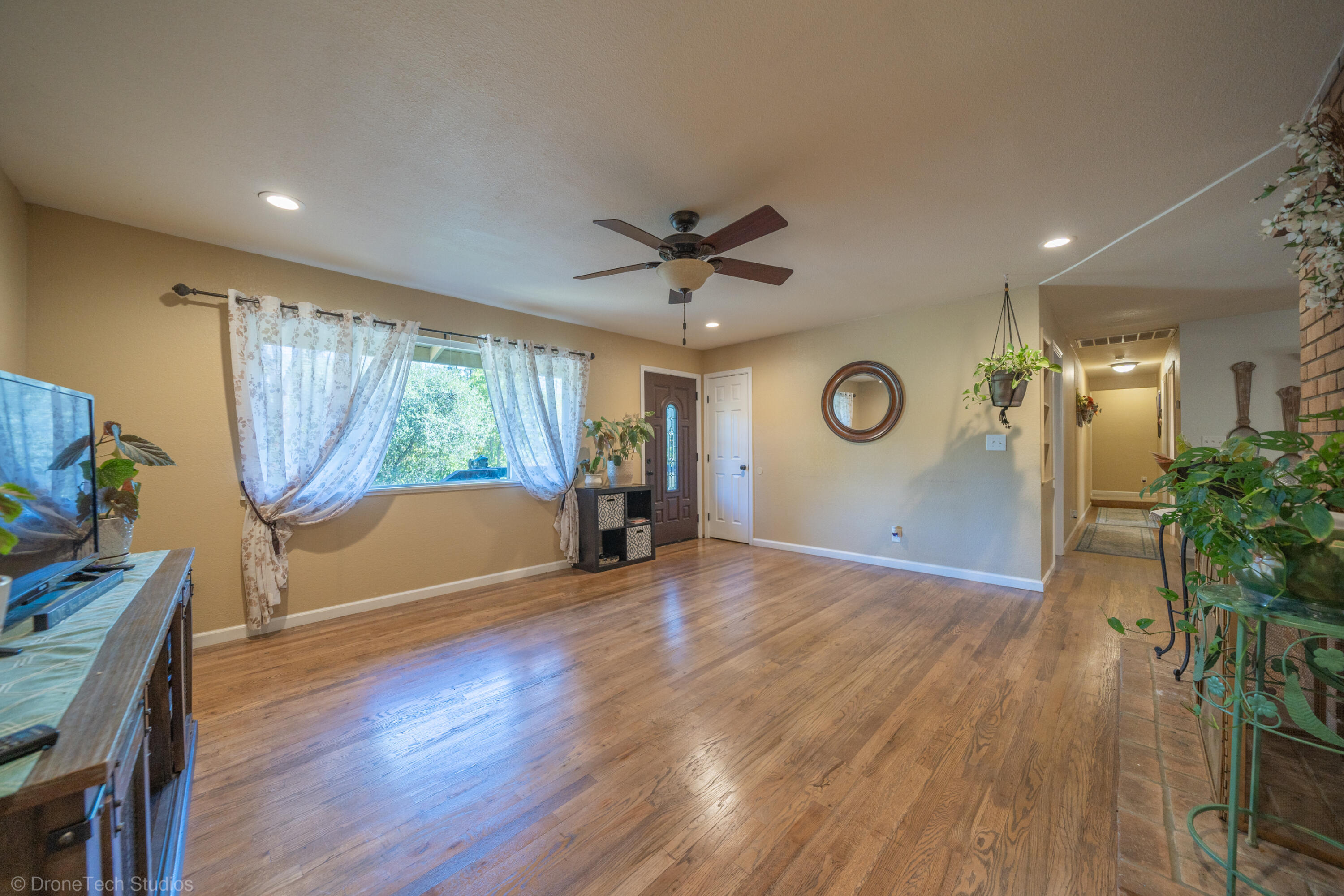 3059 Quartz Hill Road Redding, CA 96003 - Photo 11 of 64 a view of livingroom with hardwood floor and a ceiling fan