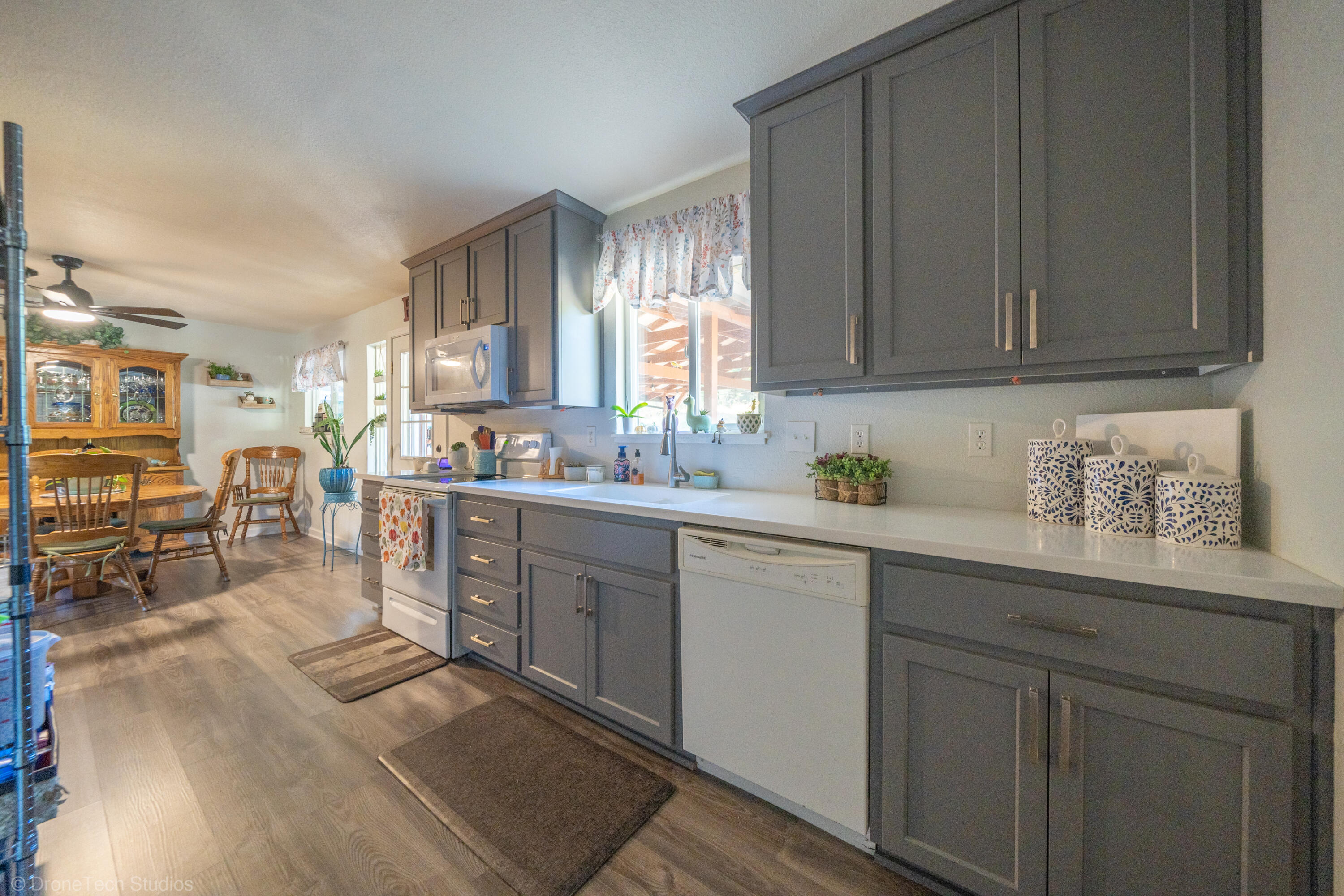3059 Quartz Hill Road Redding, CA 96003 - Photo 14 of 64 a kitchen with sink cabinets and window