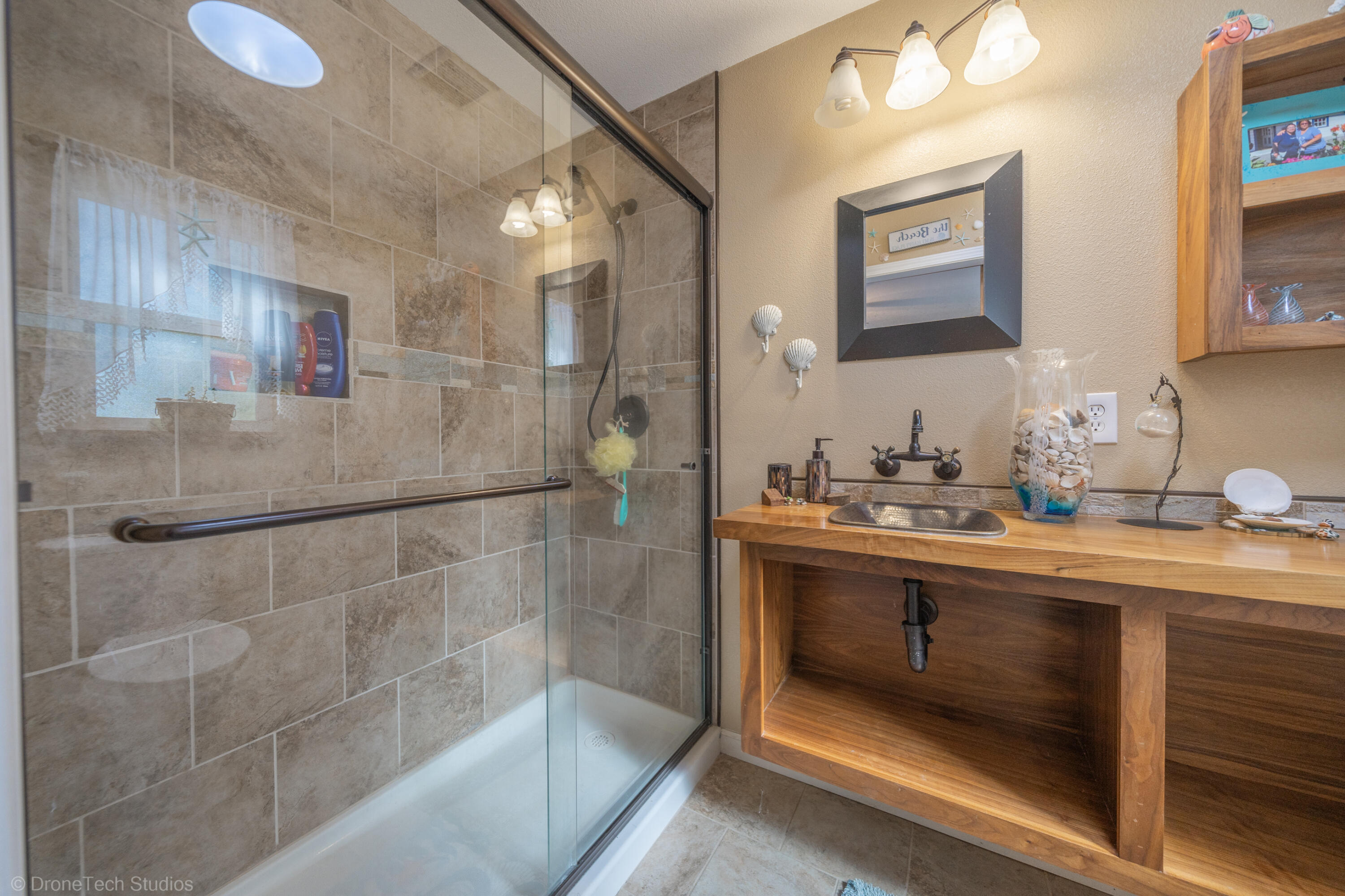 3059 Quartz Hill Road Redding, CA 96003 - Photo 17 of 64 a bathroom with a sink and mirror