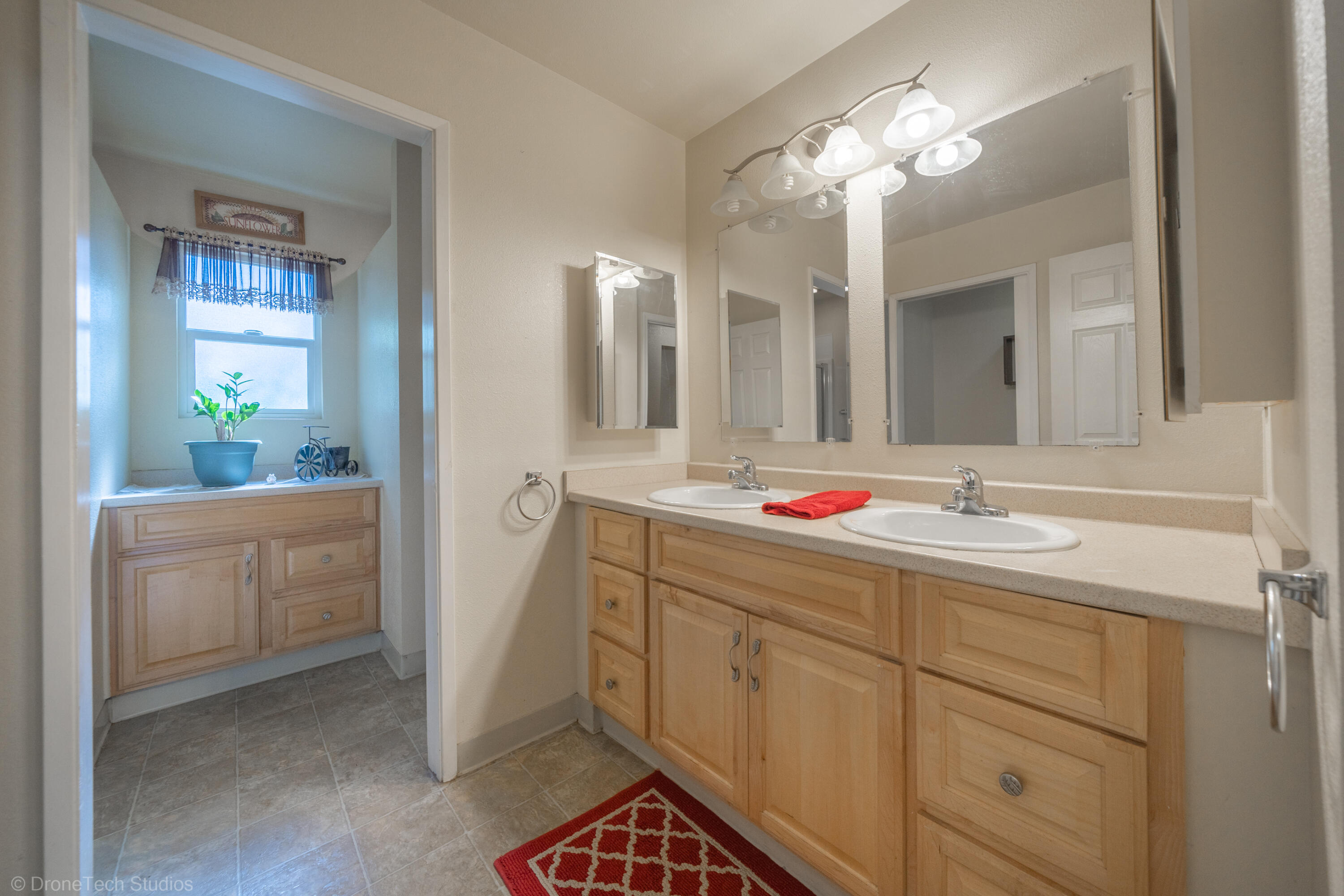 3059 Quartz Hill Road Redding, CA 96003 - Photo 26 of 64 a bathroom with a sink and a mirror