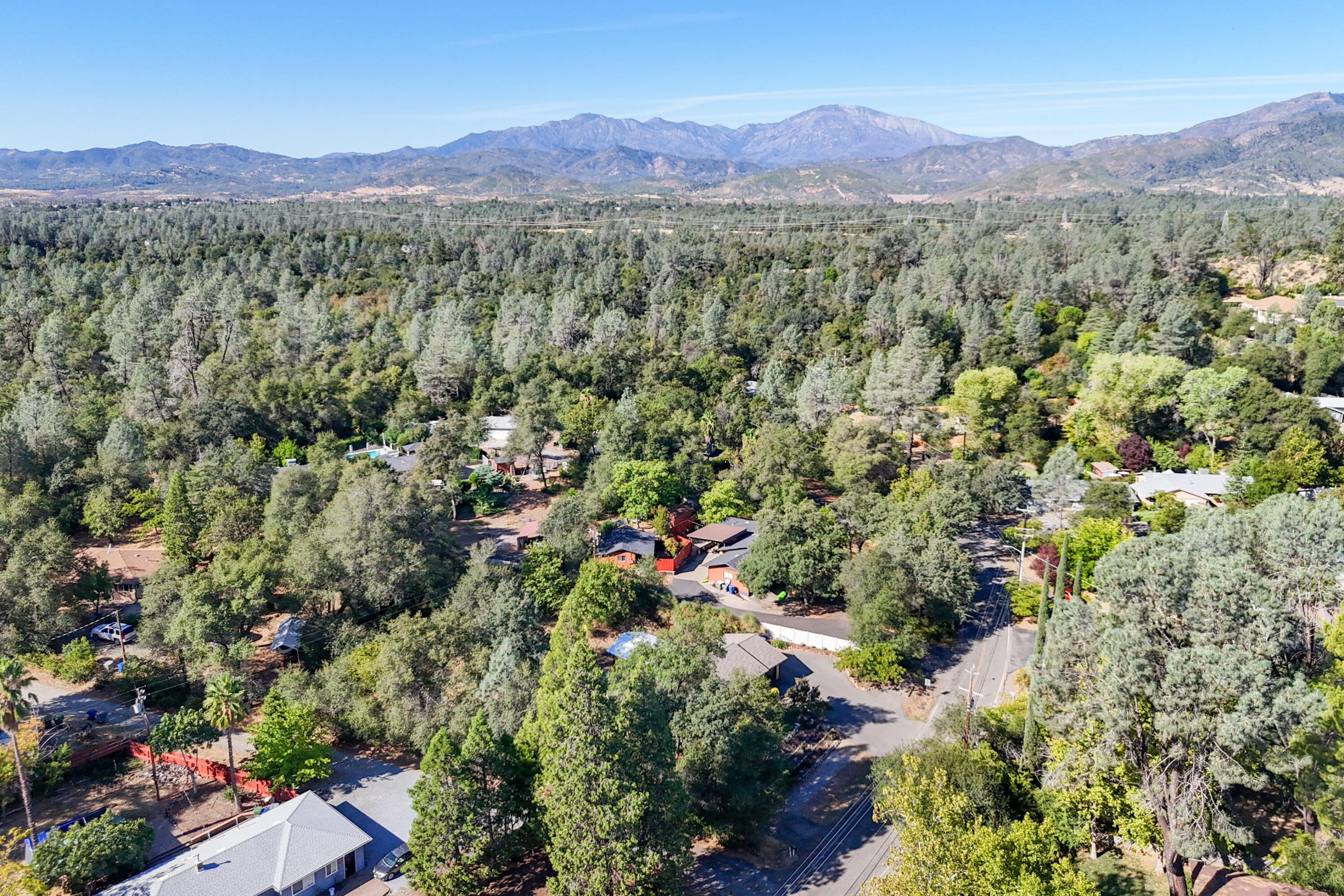 3059 Quartz Hill Road Redding, CA 96003 - Photo 33 of 64 a view of a lush green hillside and houses