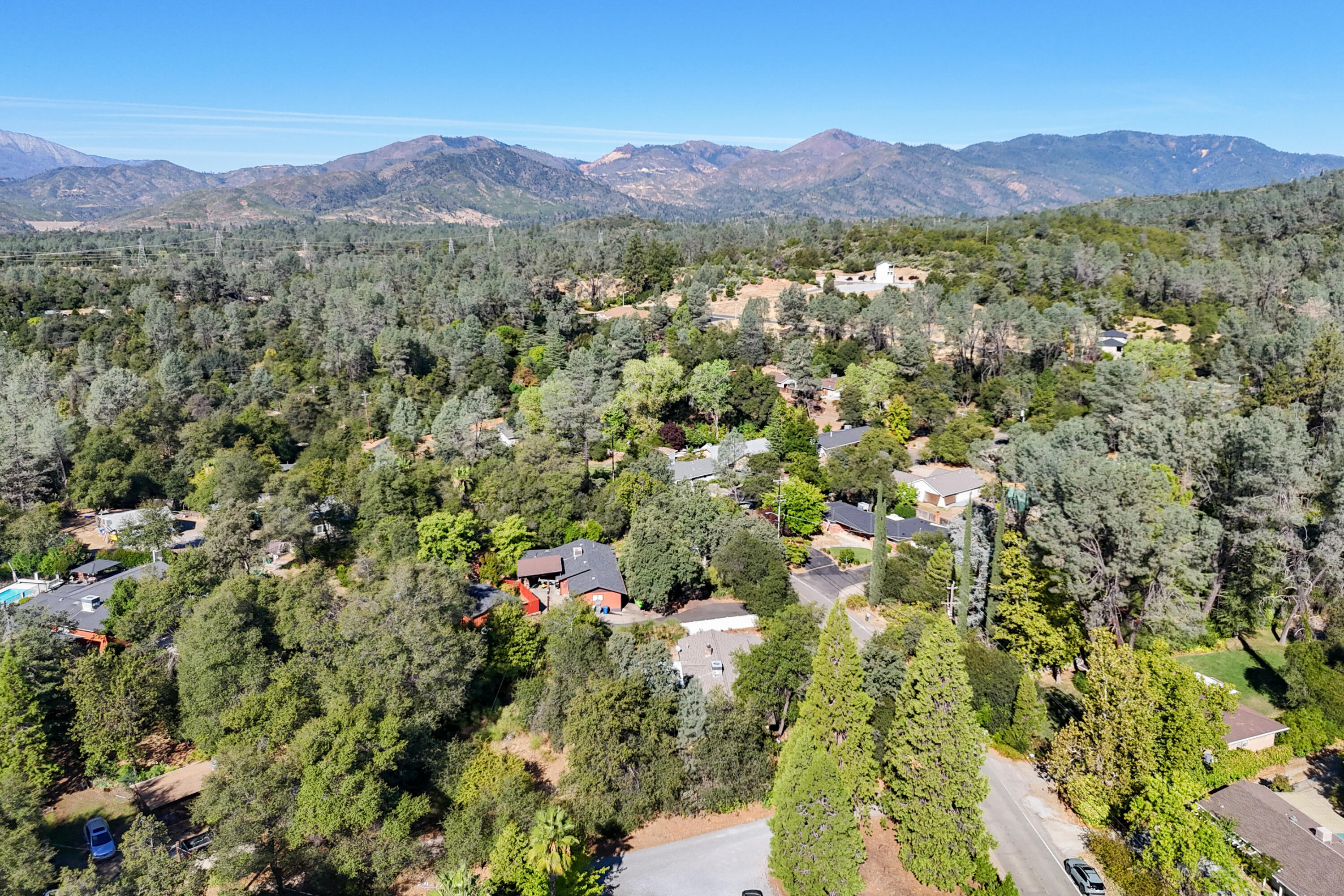 3059 Quartz Hill Road Redding, CA 96003 - Photo 41 of 64 a view of a lush green hillside and a houses