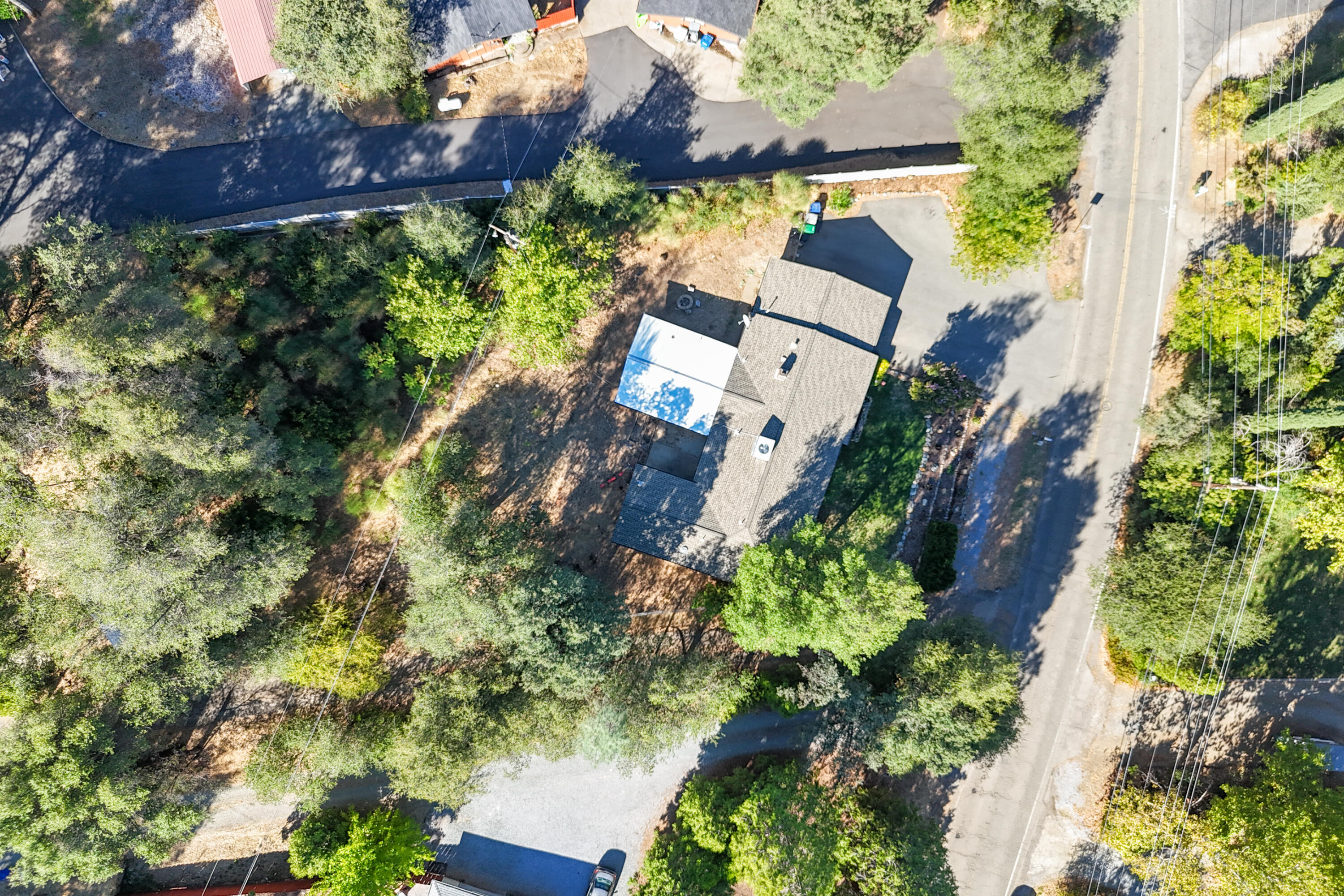 3059 Quartz Hill Road Redding, CA 96003 - Photo 46 of 64 an aerial view of a house with a yard and garden