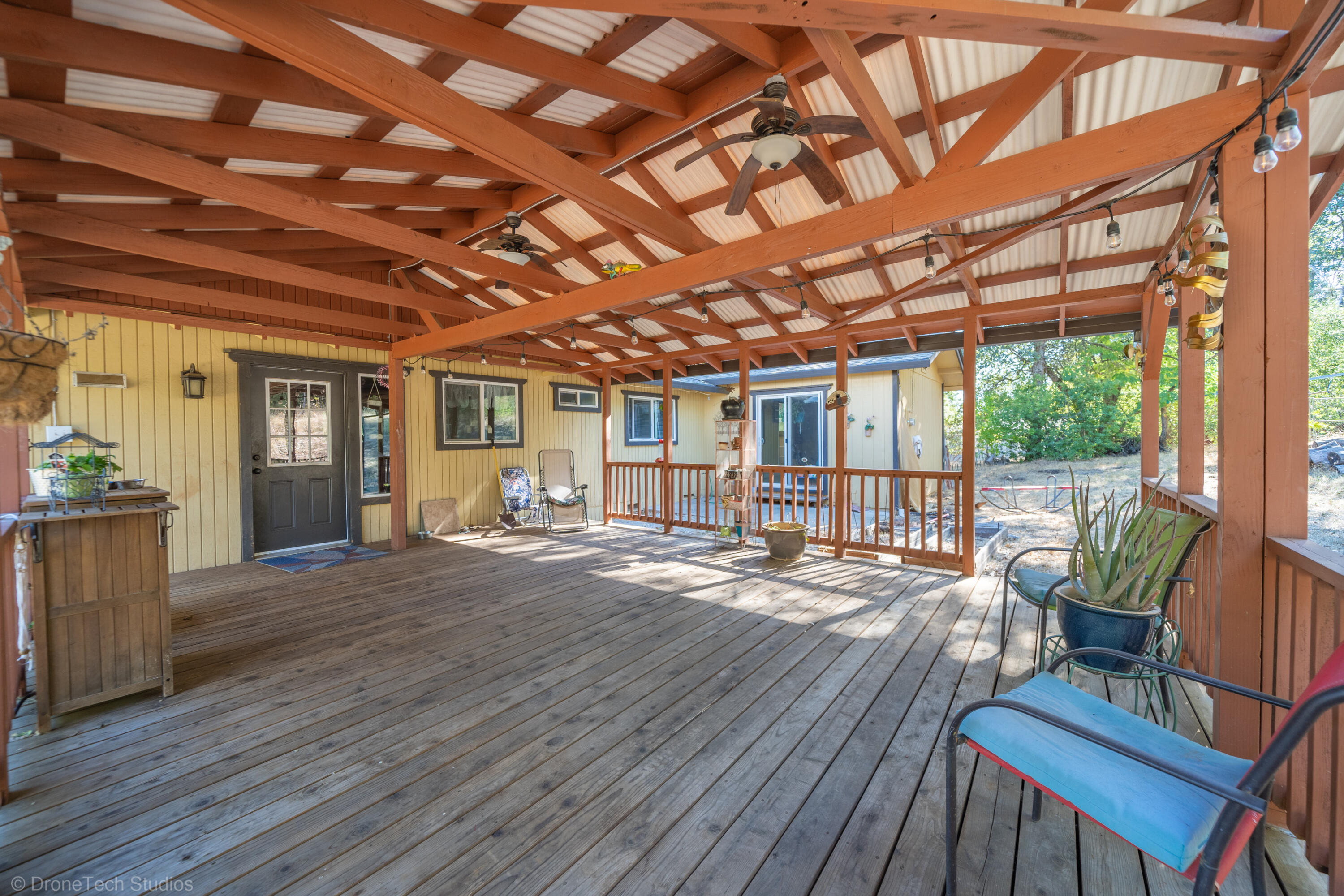 3059 Quartz Hill Road Redding, CA 96003 - Photo 50 of 64 a outdoor space with wooden seating