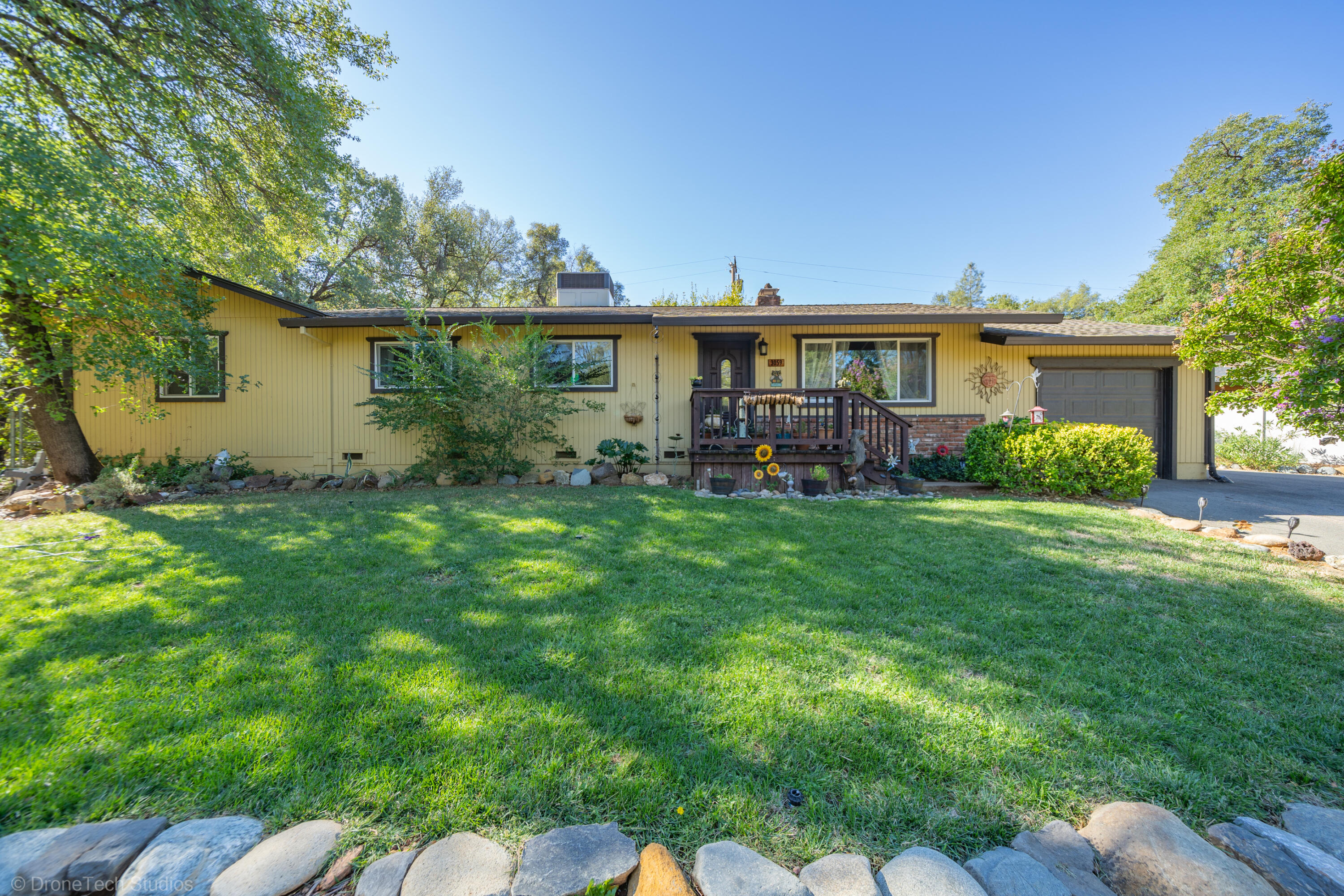 3059 Quartz Hill Road Redding, CA 96003 - Photo 59 of 64 a view of a house with a yard and sitting area