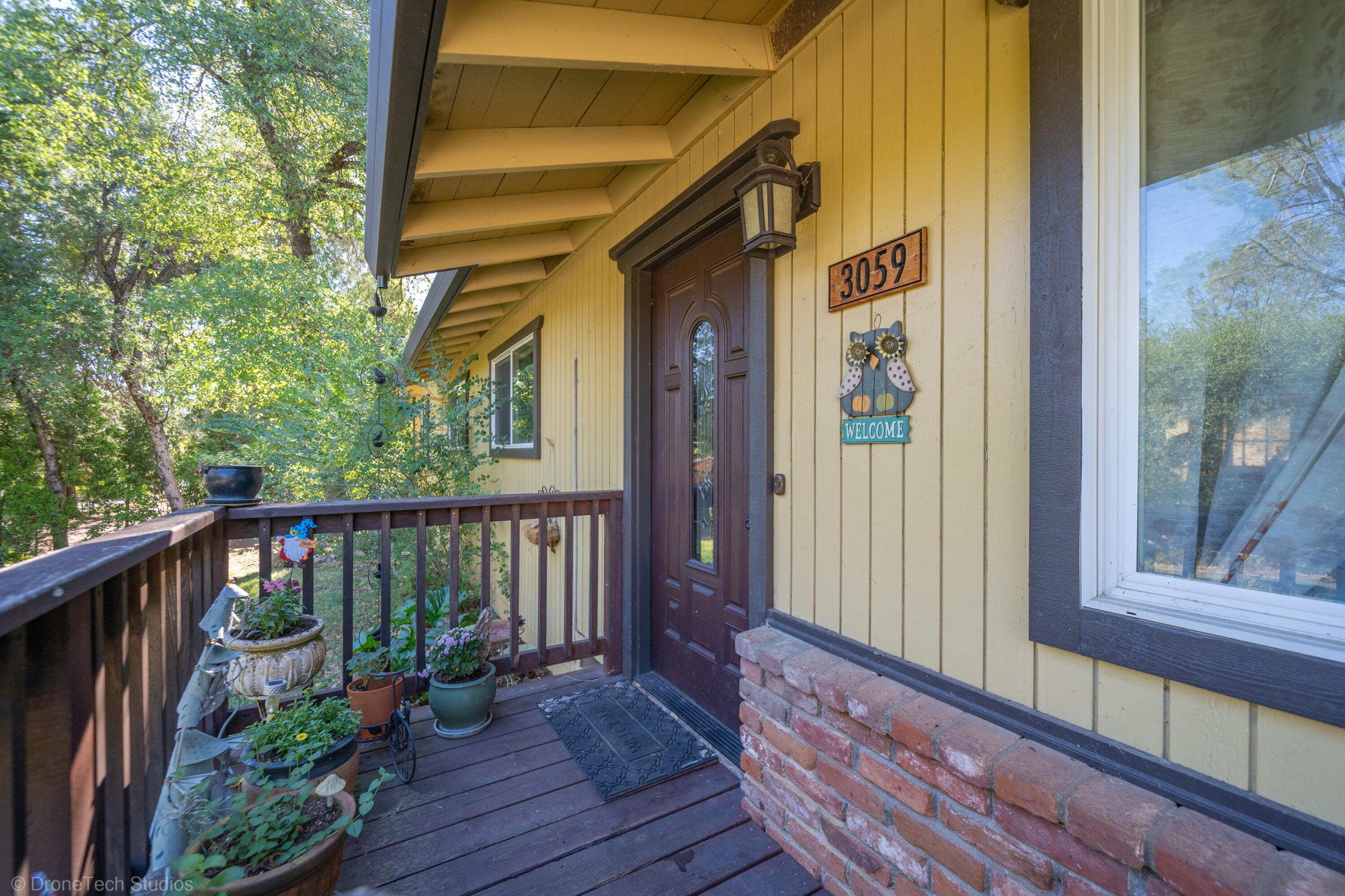 3059 Quartz Hill Road Redding, CA 96003 - Photo 8 of 64 a view of a house with a porch