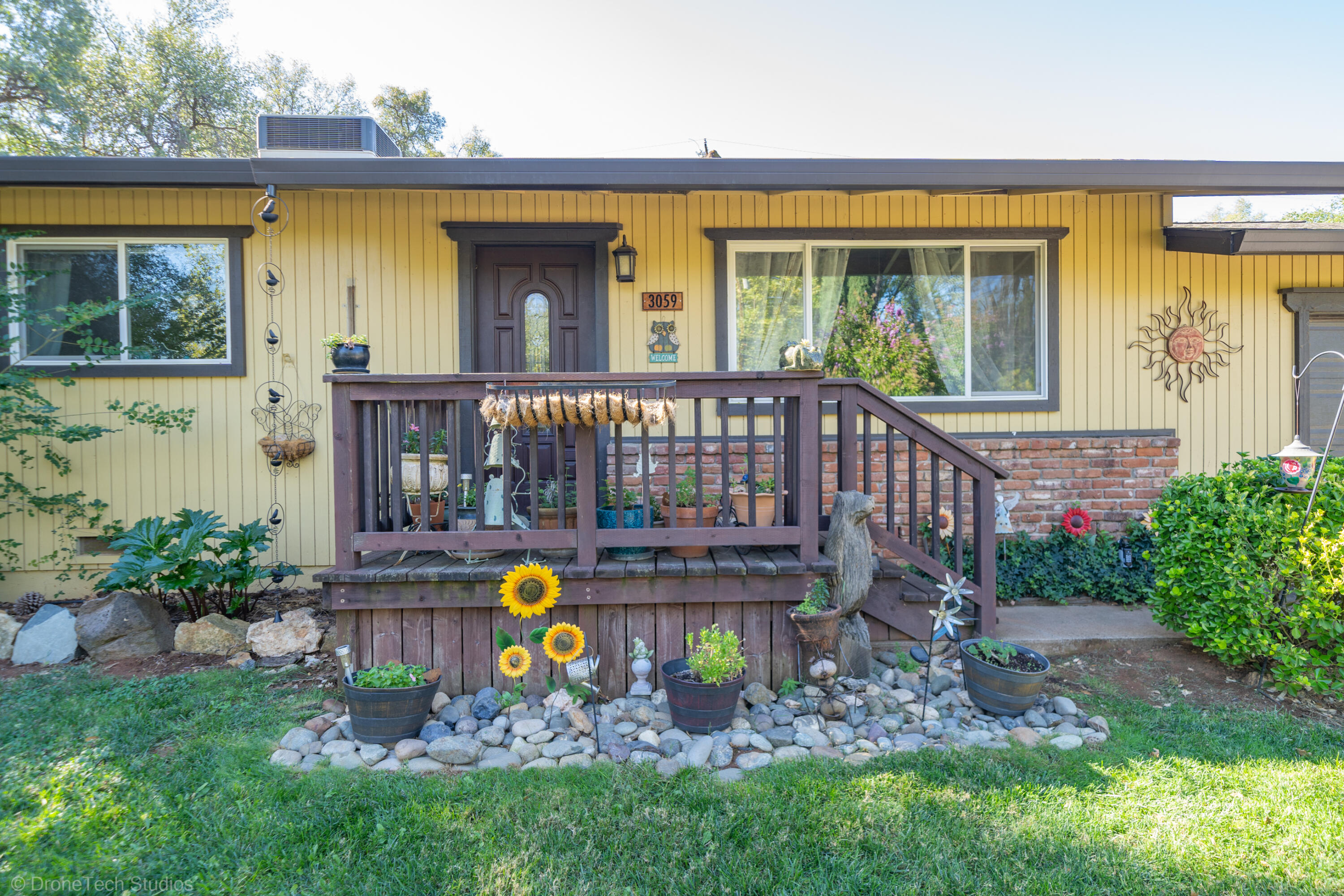 3059 Quartz Hill Road Redding, CA 96003 - Photo 9 of 64 a view of a house with a chairs in a patio