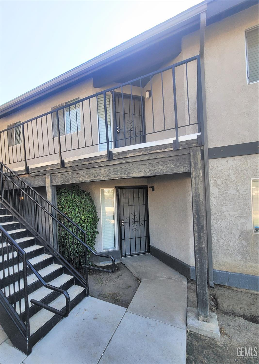 Undisclosed Address Bakersfield, CA 93309 - Photo 1 of 8 a view of entryway with a house