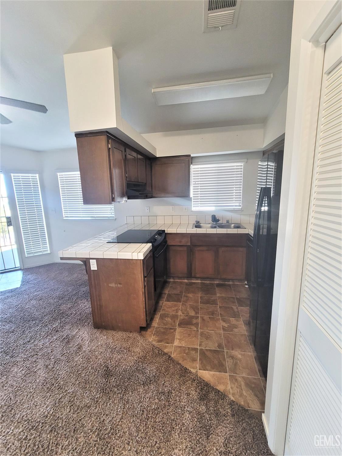 Undisclosed Address Bakersfield, CA 93309 - Photo 3 of 8 a kitchen with stainless steel appliances granite countertop a stove a sink and a refrigerator