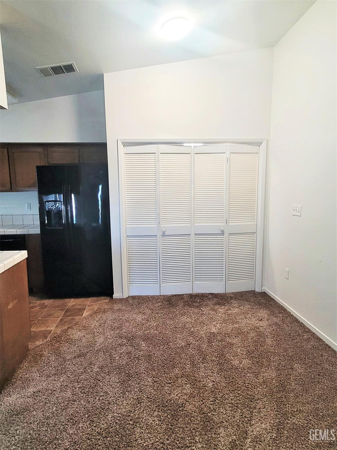 Undisclosed Address Bakersfield, CA 93309 - Photo 5 of 8 a view of an empty room with closet