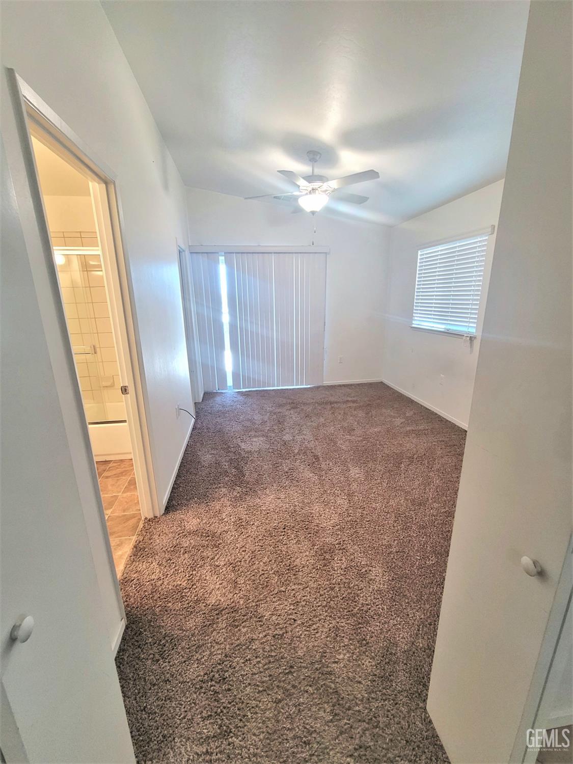 Undisclosed Address Bakersfield, CA 93309 - Photo 6 of 8 a view of a big room with windows and closet