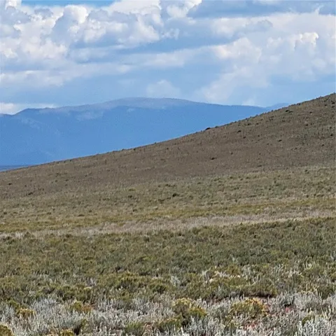 a view of an ocean and mountain