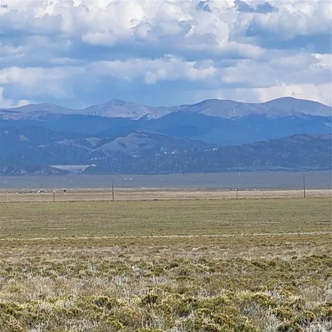 a view of an ocean beach and mountain