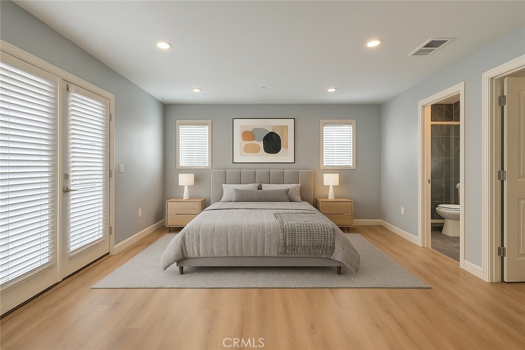 2108 La Paloma Avenue Alhambra, CA 91803 - Photo 6 of 15 a bedroom with a large bed and a wooden floor