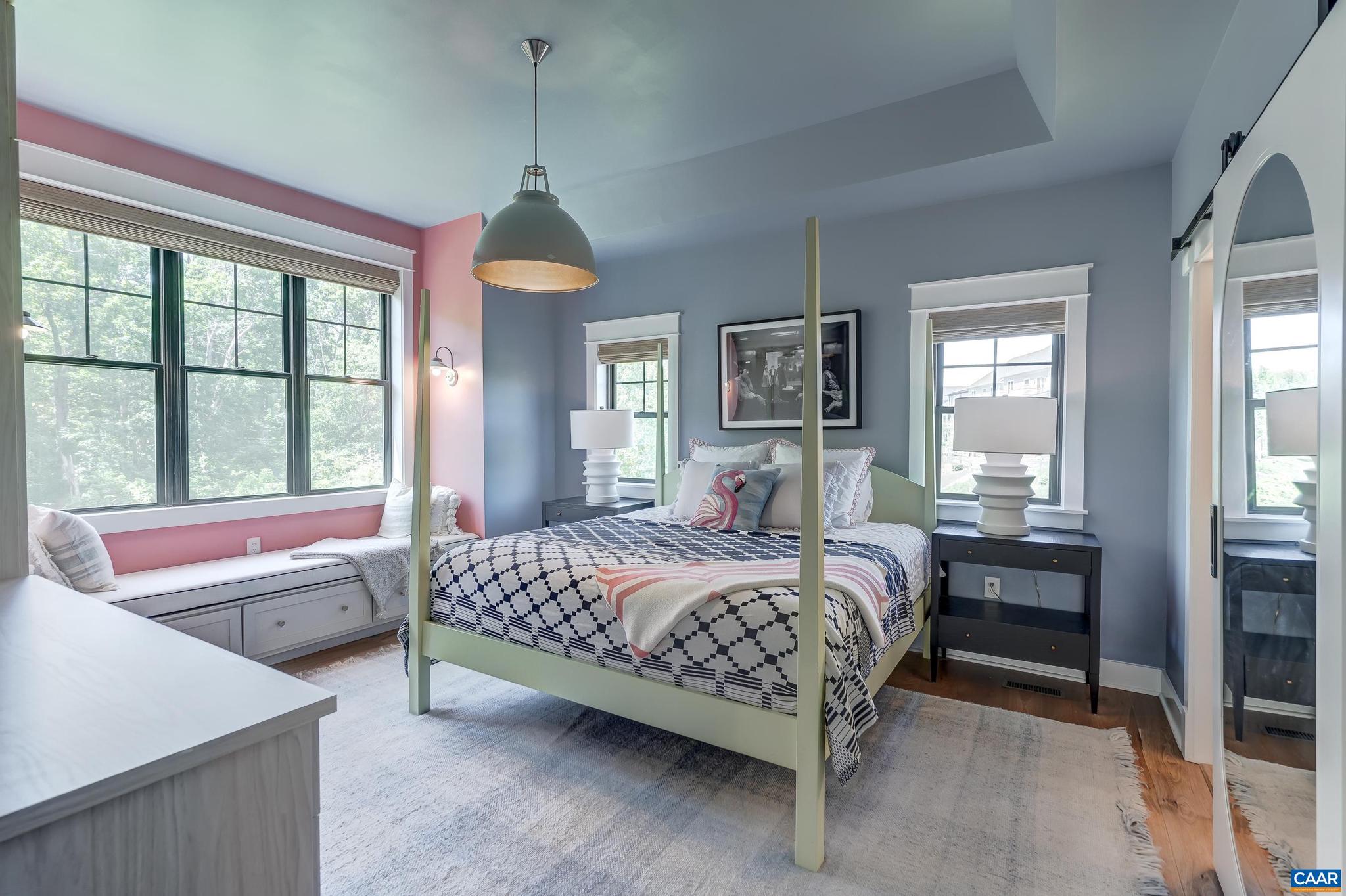 3327 Rowcross Street Crozet, VA 22932 - Photo 23 of 63 a bedroom with a bed and a chandelier