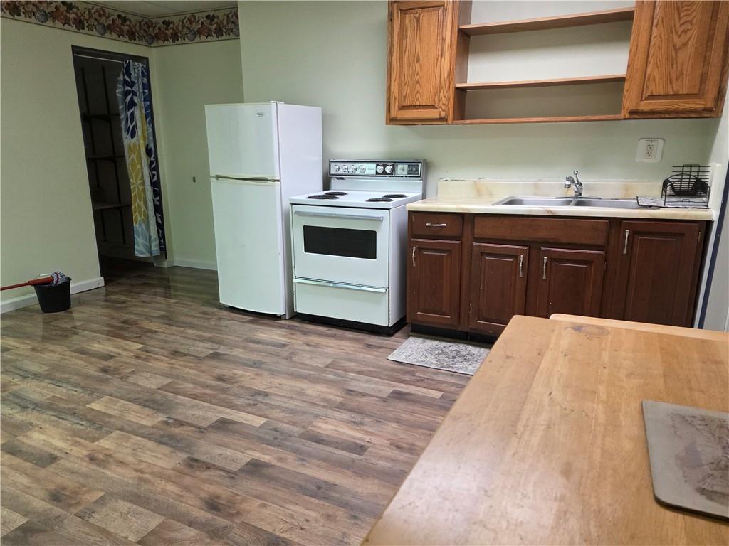 1826 Freeport Road, Unit B New Kensington, PA 15068 - Photo 4 of 8 a kitchen with a sink and a refrigerator