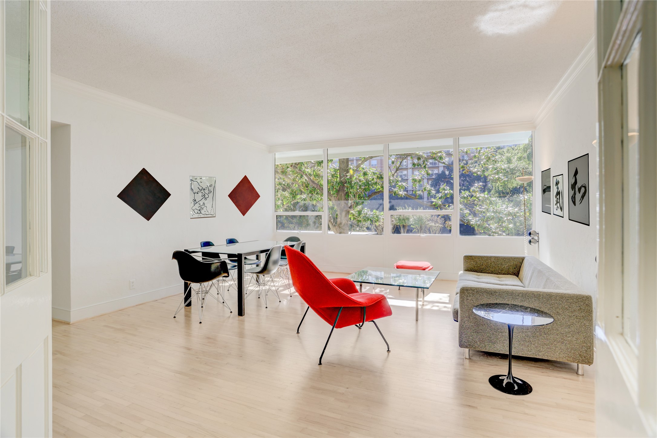 2701 Westheimer Road, Unit 2D Houston, TX 77098 - Photo 7 of 48 A generously scaled living area provides exceptional flexibility, with ample room for both a comfortable living space and a dedicated dining area, ideal for entertaining or relaxed daily living.