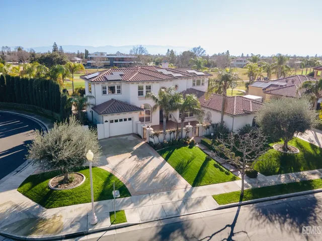 a view of a city with lawn chairs and a potted plant