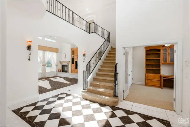 a view of an empty room with a cabinet and a window