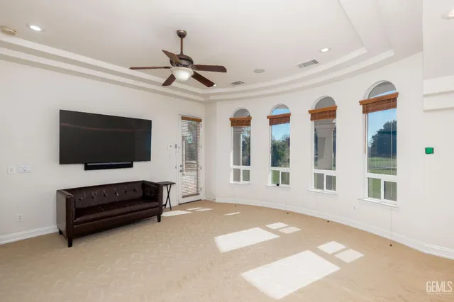 a spacious bathroom with a double vanity sink and a mirror