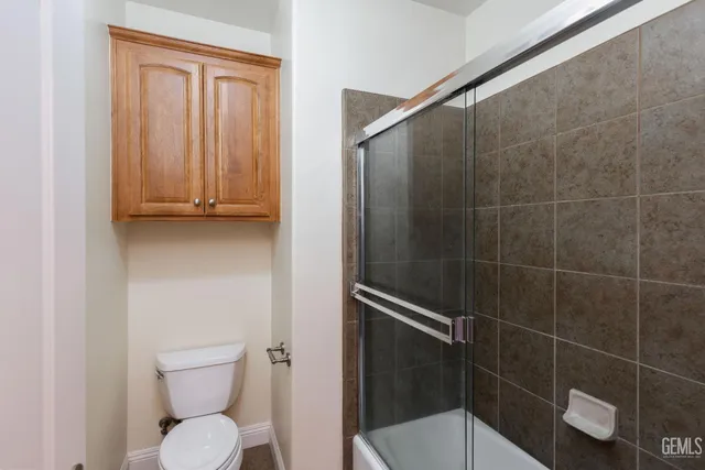 a kitchen with a stove and a refrigerator