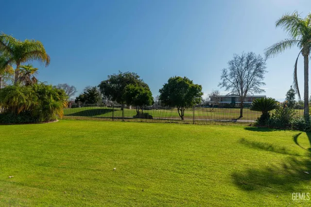 a view of a golf course with a lake view