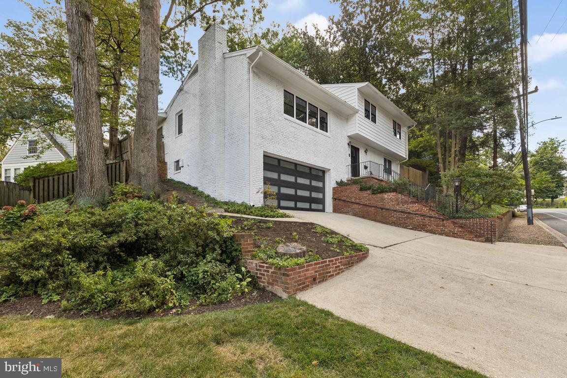 3209 Military Road Arlington, VA 22207 - Photo 2 of 45 a front view of a house with garden
