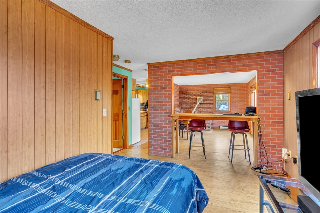 1 Flagg Hill Road Heath, MA 01346 - Photo 9 of 26 a bedroom with a bed and a flat screen tv