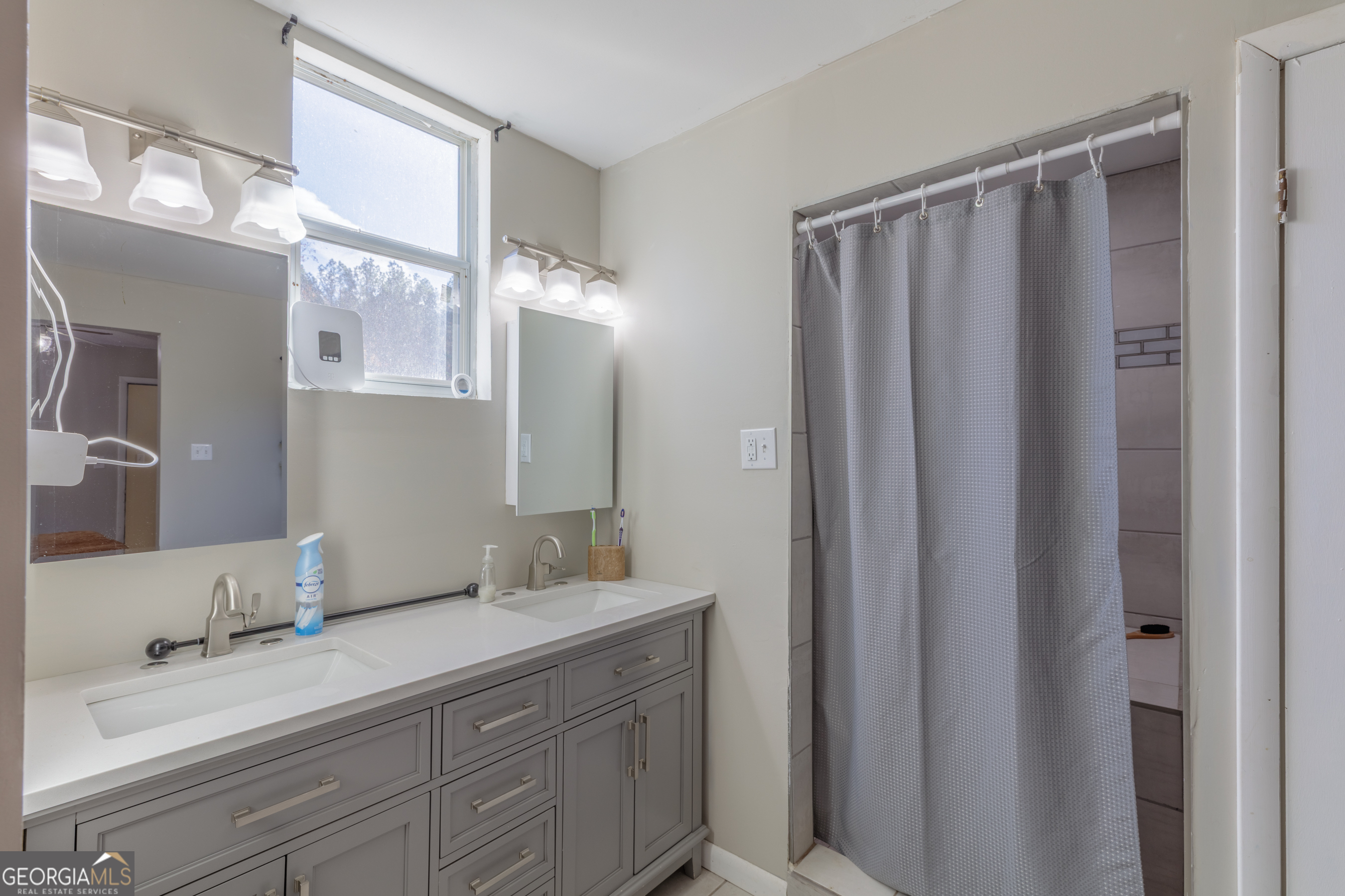 1144 Ridgeway Road LaFayette, GA 30728 - Photo 43 of 79 a bathroom with a double vanity sink and mirror