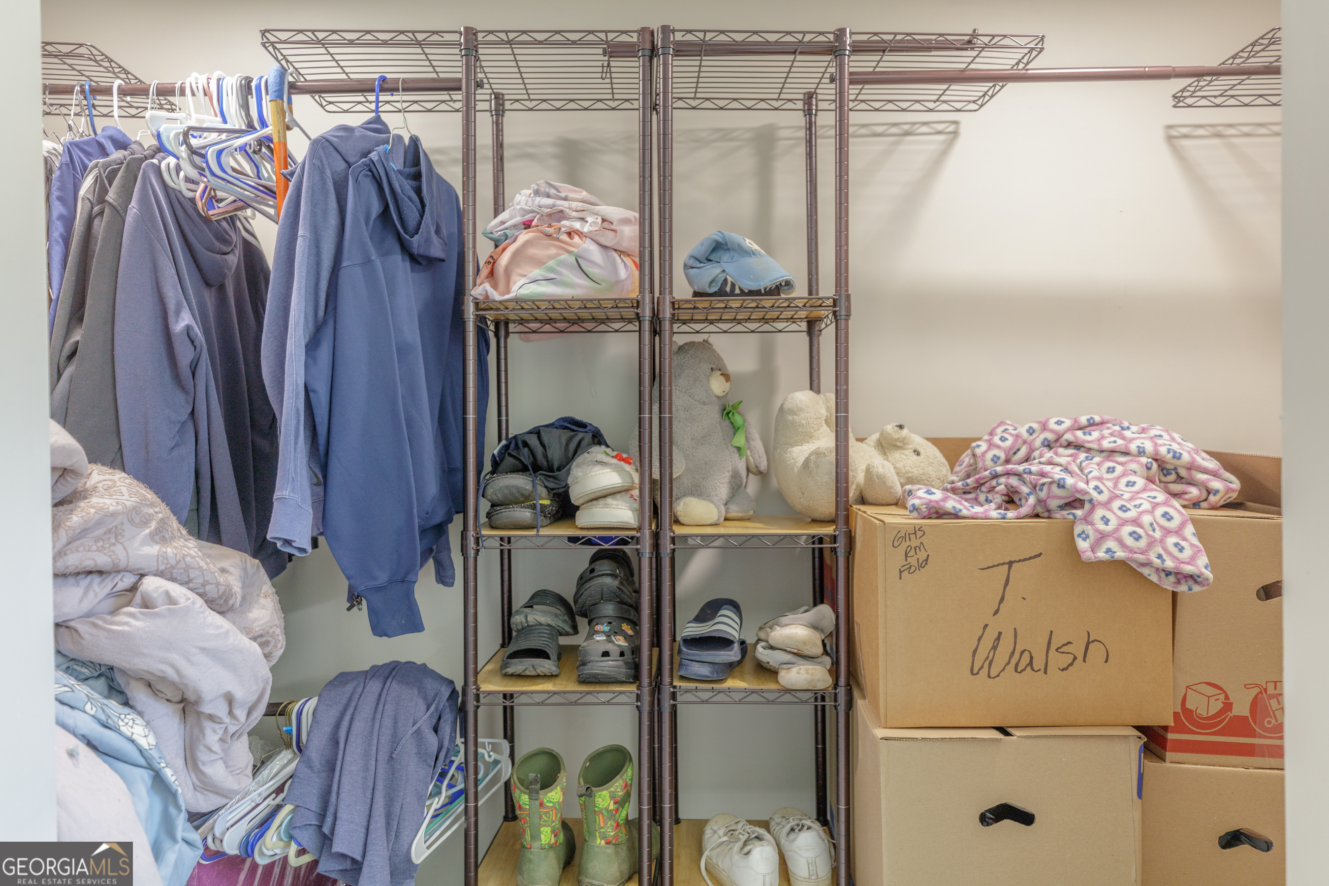 1144 Ridgeway Road LaFayette, GA 30728 - Photo 48 of 79 a view of walk in closet with clothes and shoes