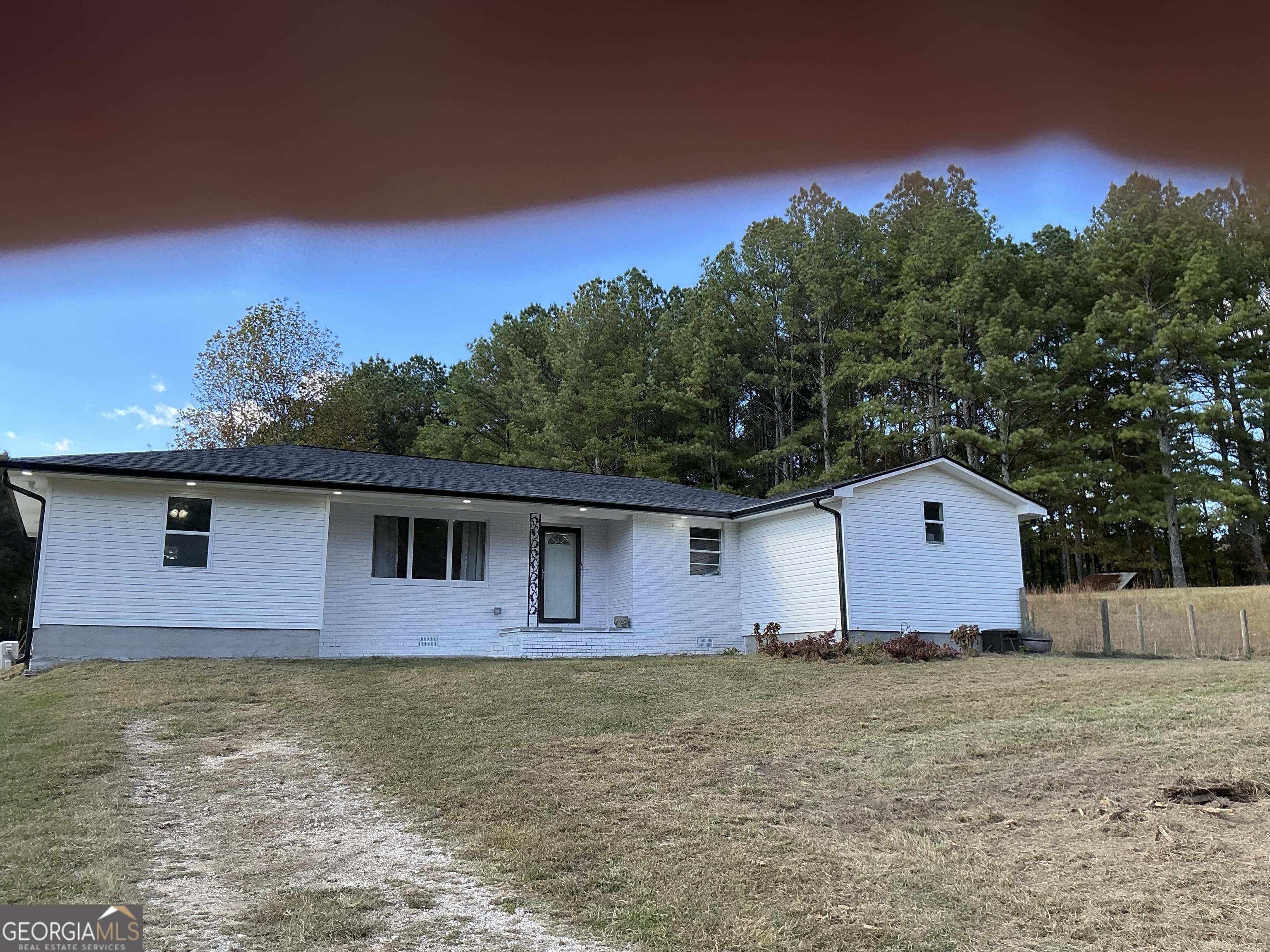 1144 Ridgeway Road LaFayette, GA 30728 - Photo 5 of 79 a front view of house with yard and trees in the background